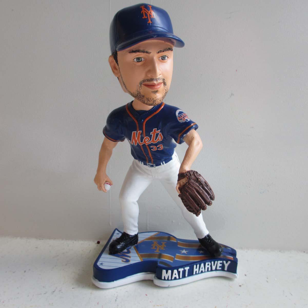 New York Mets pitcher Matt Harvey peels off the uniform in the